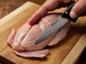 Cutting a pocket into chicken breast for stuffing