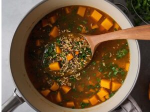 Simmering butternut squash with spices and broth