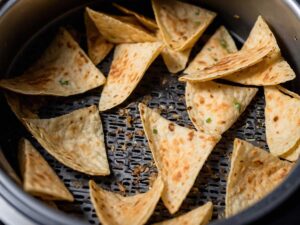 Layering tortilla chips in air fryer basket