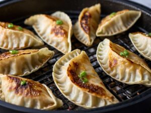 Checking golden-brown gyoza for doneness