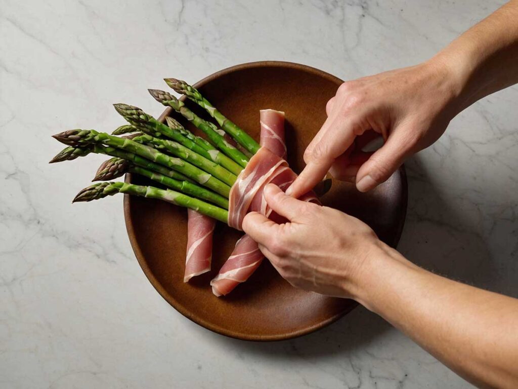 wrapping asparagus with prosciutto