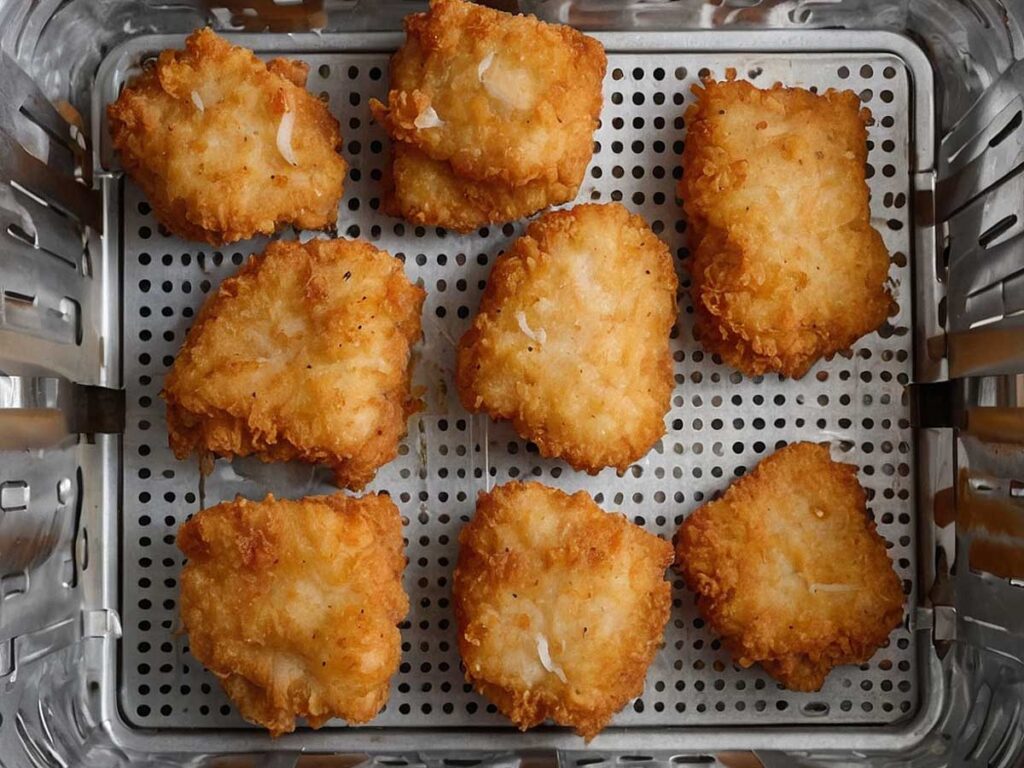 Arranging Trader Joe's fish nuggets in air fryer basket